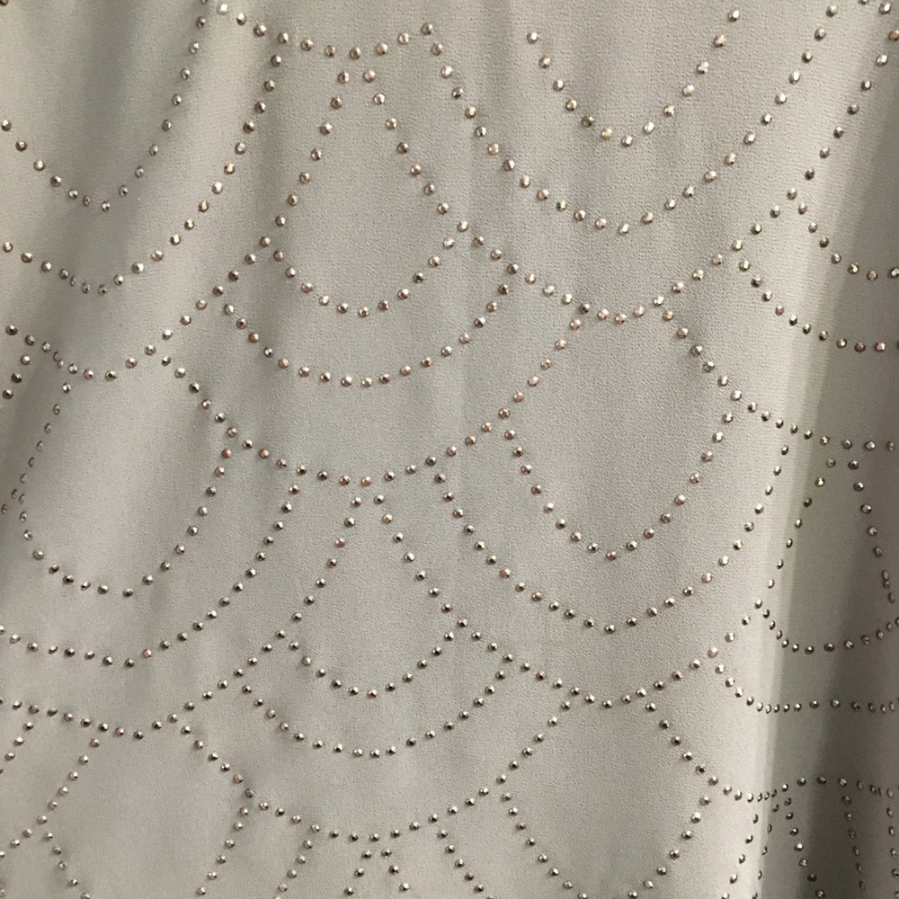 Blousy, gold/greenish brown top with gold accents.
